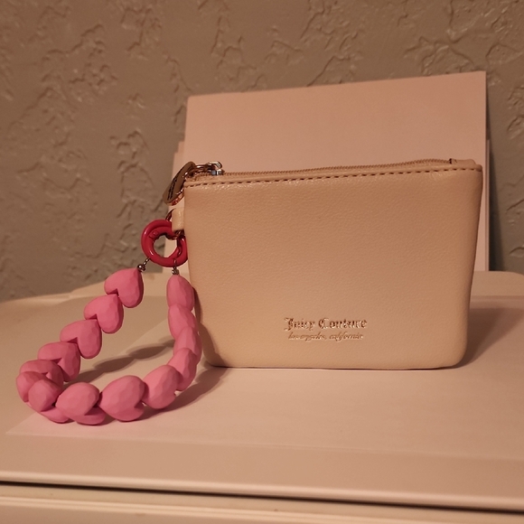 Juicy Couture Handbags - Juicy Couture Cream Pouch with Pink Heart Chain